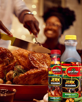 Spur Tree Jerk Seasoning being poured over meat for quick, flavorful seasoning.