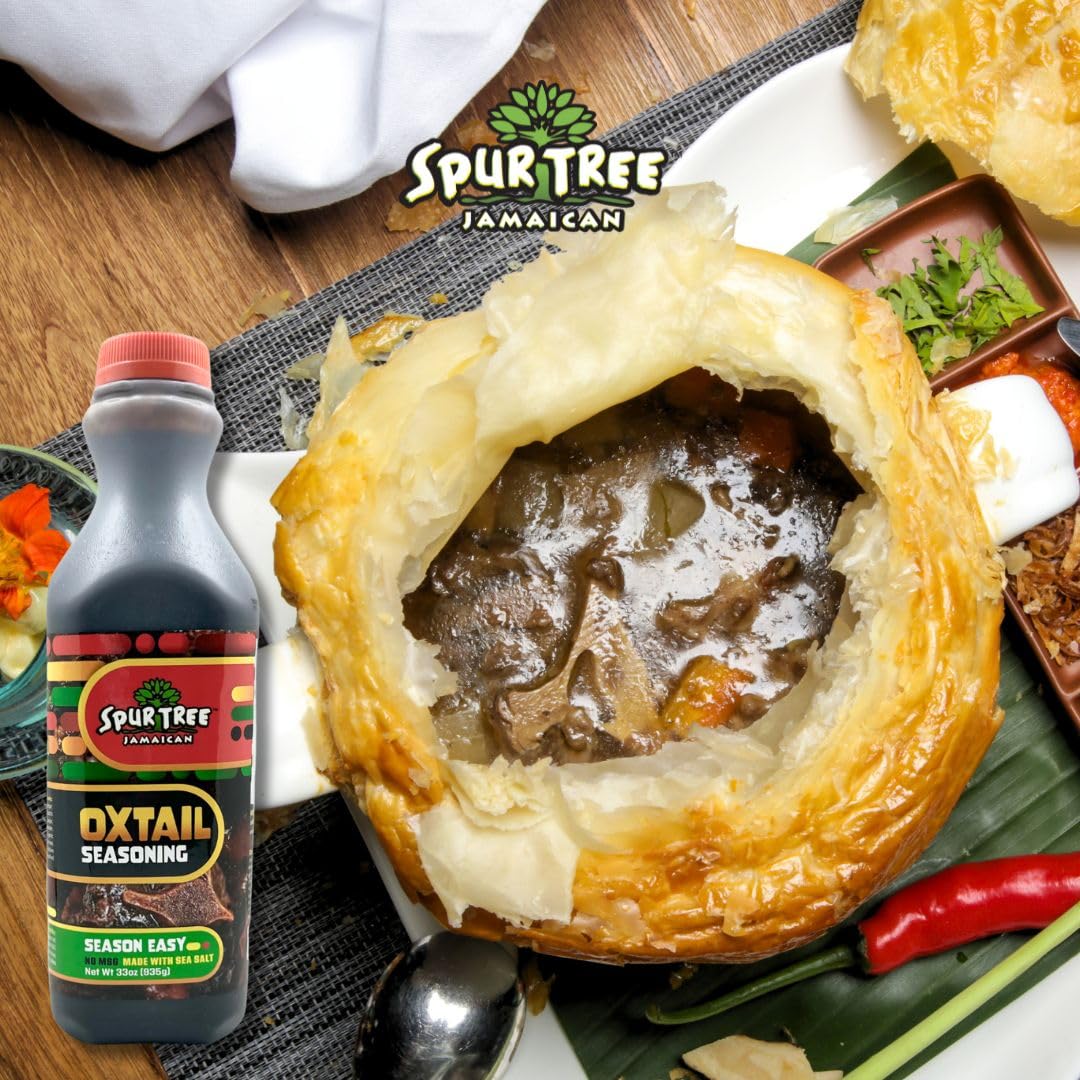 Spur Tree Oxtail Seasoning bottle pouring into pot