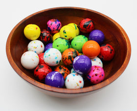 Squireboone Jawbreakers on a buffet setup in bright rainbow tones for celebrations.