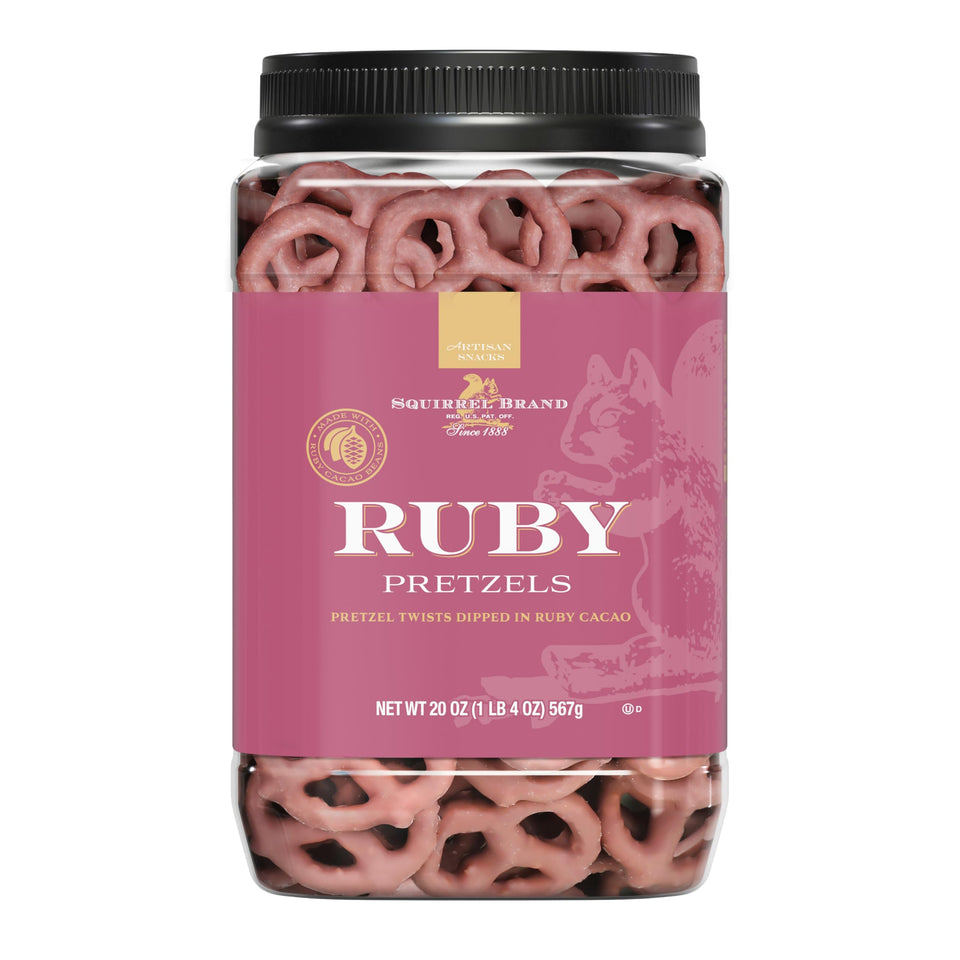 Squirrel Brand Ruby Cacao Pretzel Twists in a jar close-up showing glossy ruby coating for premium snacking.