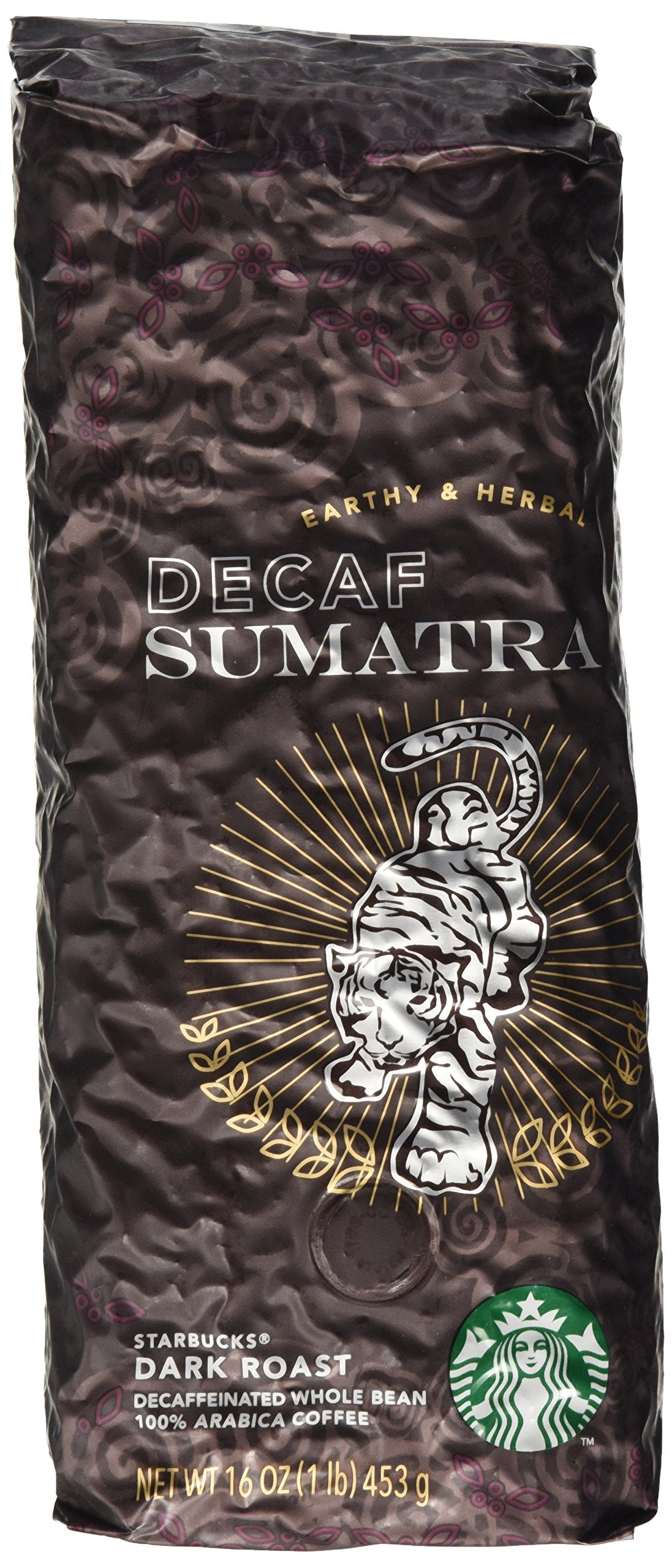 Starbucks Decaf Sumatra beans show a dark roast with oil, supporting a smooth, full-bodied cup.