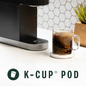 Starbucks Espresso Roast pod in cup — notes of molasses and caramel in a rich cup.