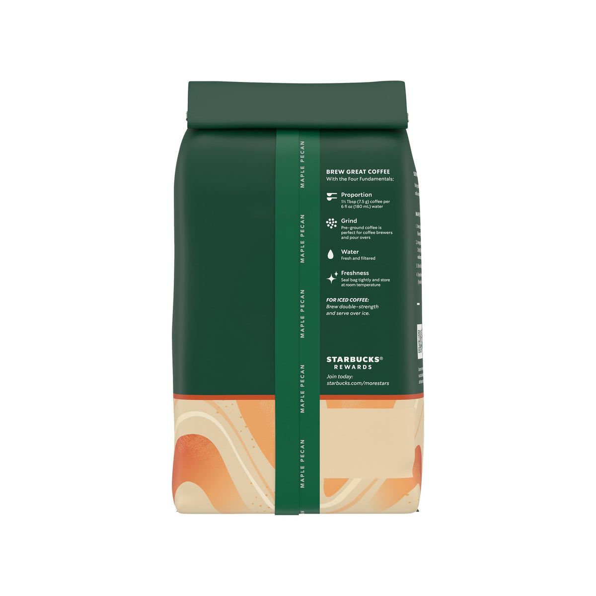 Stacked Starbucks Maple Pecan ground coffee bags on a counter.