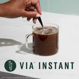 Starbucks VIA Instant French Roast packet dissolving in cup, delivering a rich aroma.