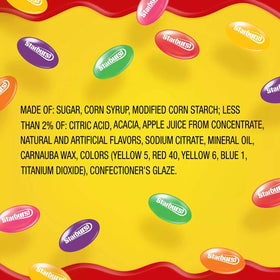 Starburst Jellybeans on a dessert table invite guests to sample fruit flavors.