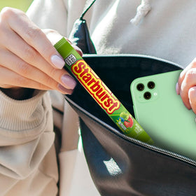 Starburst sour watermelon flavor close-up, refreshing bite for after-school snacks.