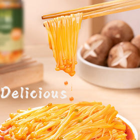 STARTZYK Enoki Mushrooms served with noodles for a quick, flavorful meal.