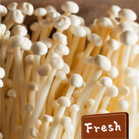 STARTZYK Enoki Mushrooms label shows production date for freshness.