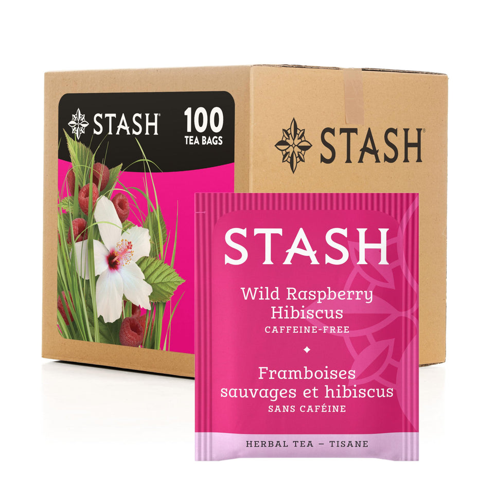 Stash Tea Wild Raspberry Hibiscus tea bag steeping in hot cup for a bright, fruity aroma.