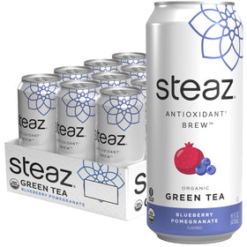 Steaz blueberry-pomegranate organic green tea can on ice, inviting fruity aroma and caffeine lift.