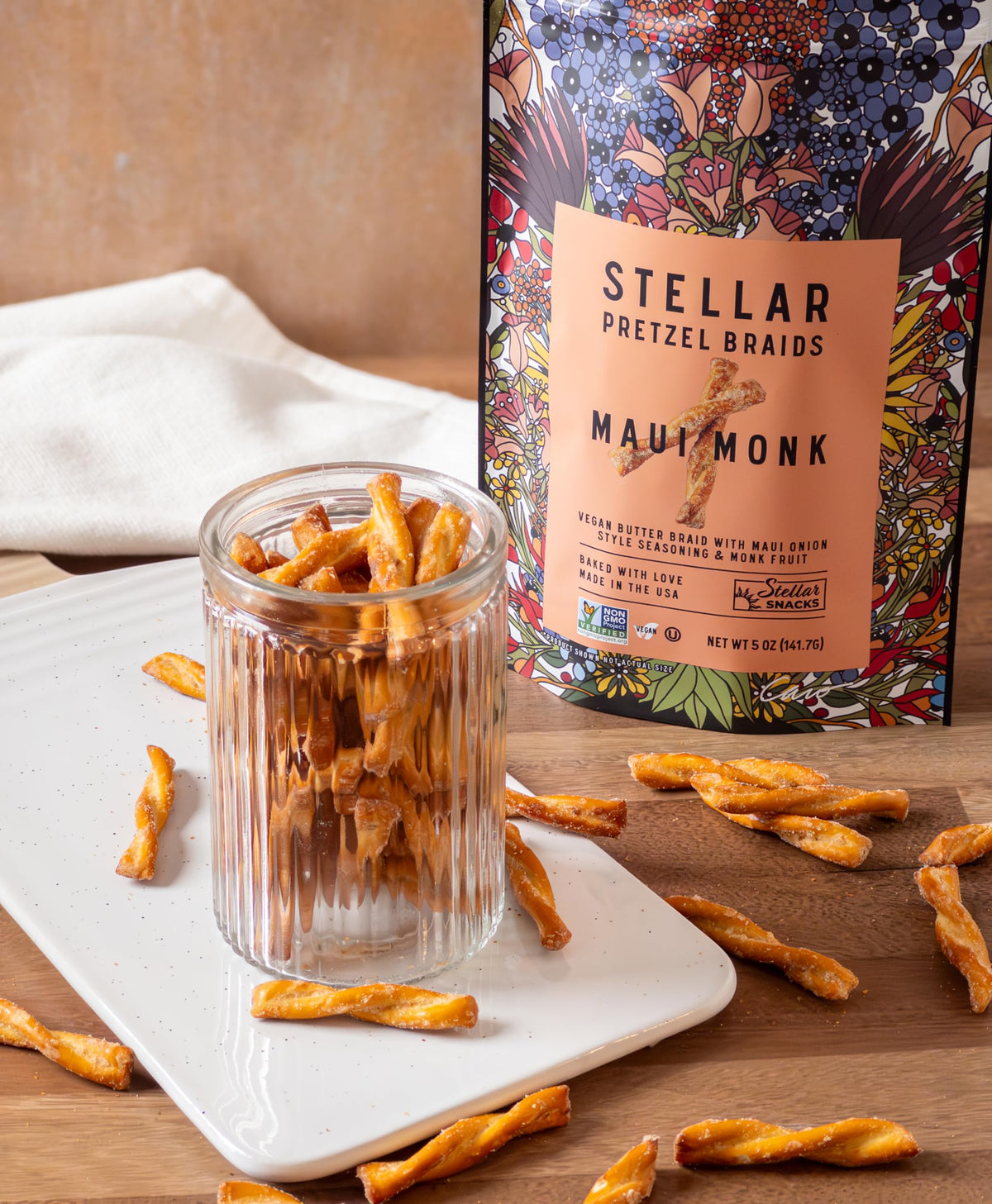 Serving plate with Stellar Snacks pretzel braids and dipping options.