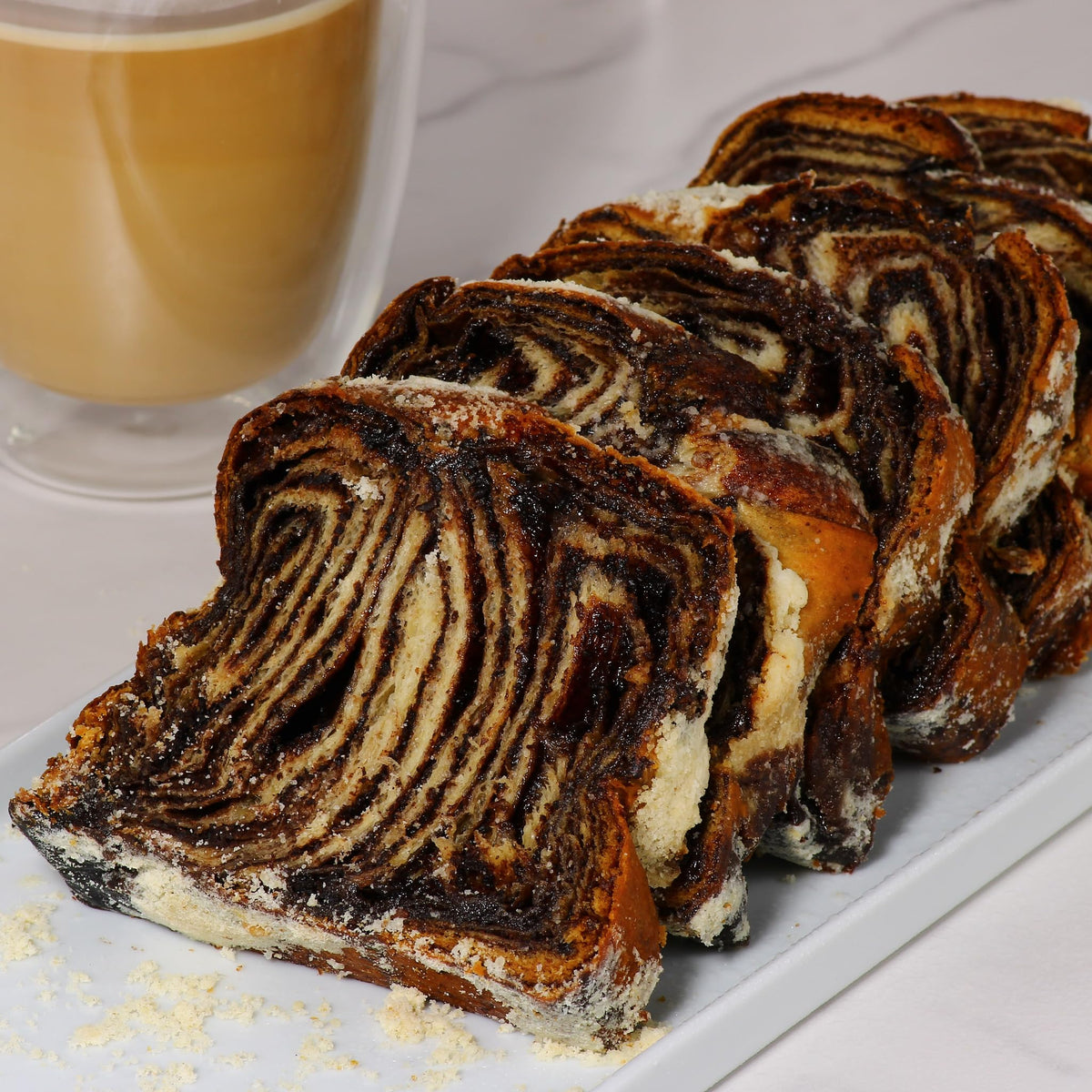 Stern’s Bakery Chocolate Babka Dough – close-up shows moist crumb and chocolate swirls.