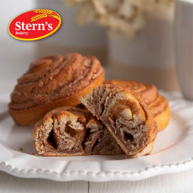 Stern's Bakery Cinnamon Buns being unwrapped, inviting aroma.