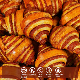 Stern's Bakery cinnamon rolls baking on a tray with inviting aroma.
