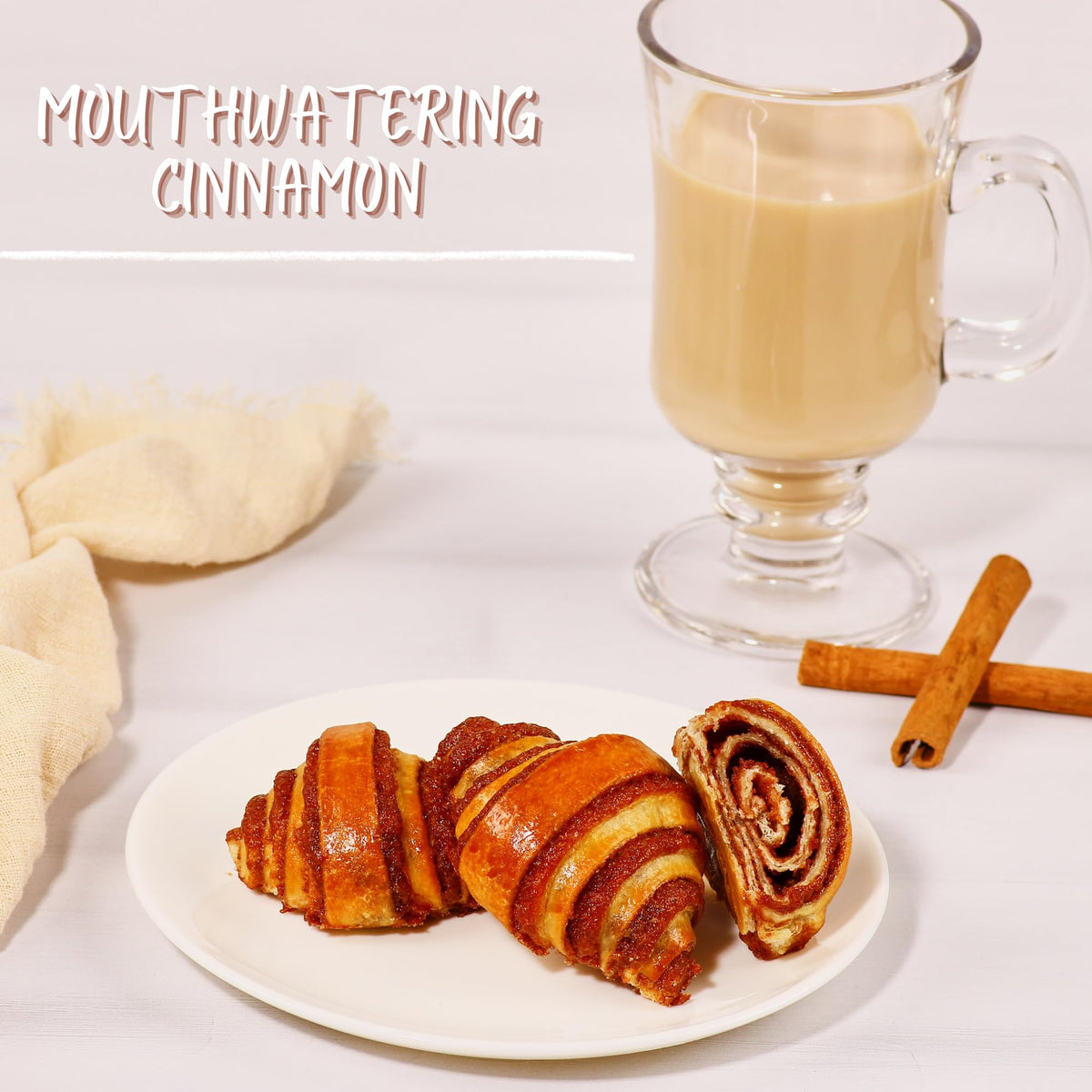 Stern's Bakery cinnamon rolls plated with coffee for a comforting breakfast.
