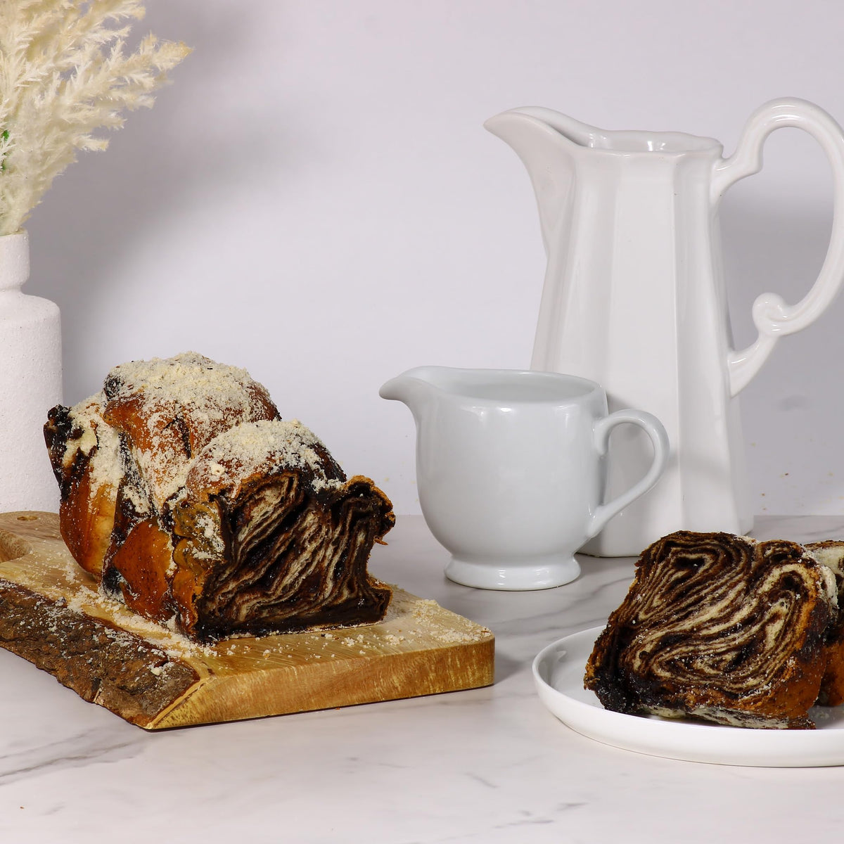 Stern’s Bakery Fresh Daily – bakery scene featuring freshly made babka loaves.