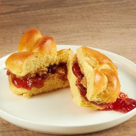 Close-up of soft, egg-enriched Stern's Bakery challah roll texture.