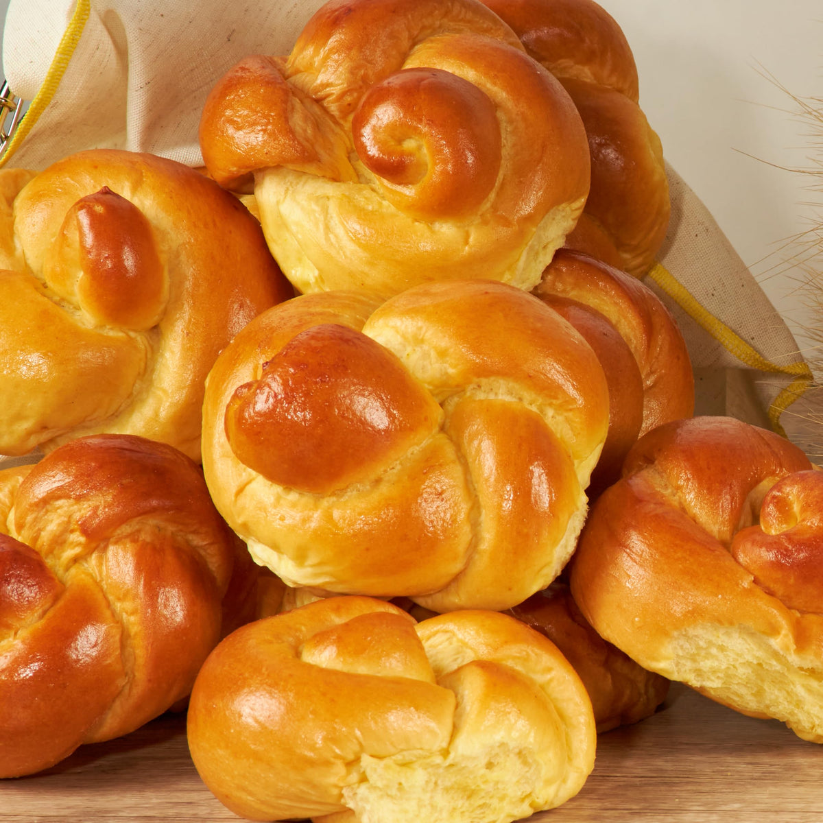 Fresh-baked Stern's Bakery challah rolls with golden crust for Shabbat.