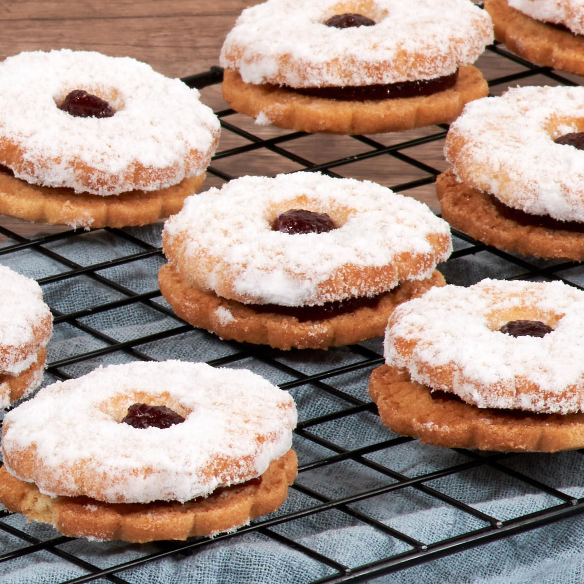 Gift box featuring Stern’s Bakery raspberry Linzer cookies ready to share