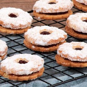 Gift box featuring Stern’s Bakery raspberry Linzer cookies ready to share