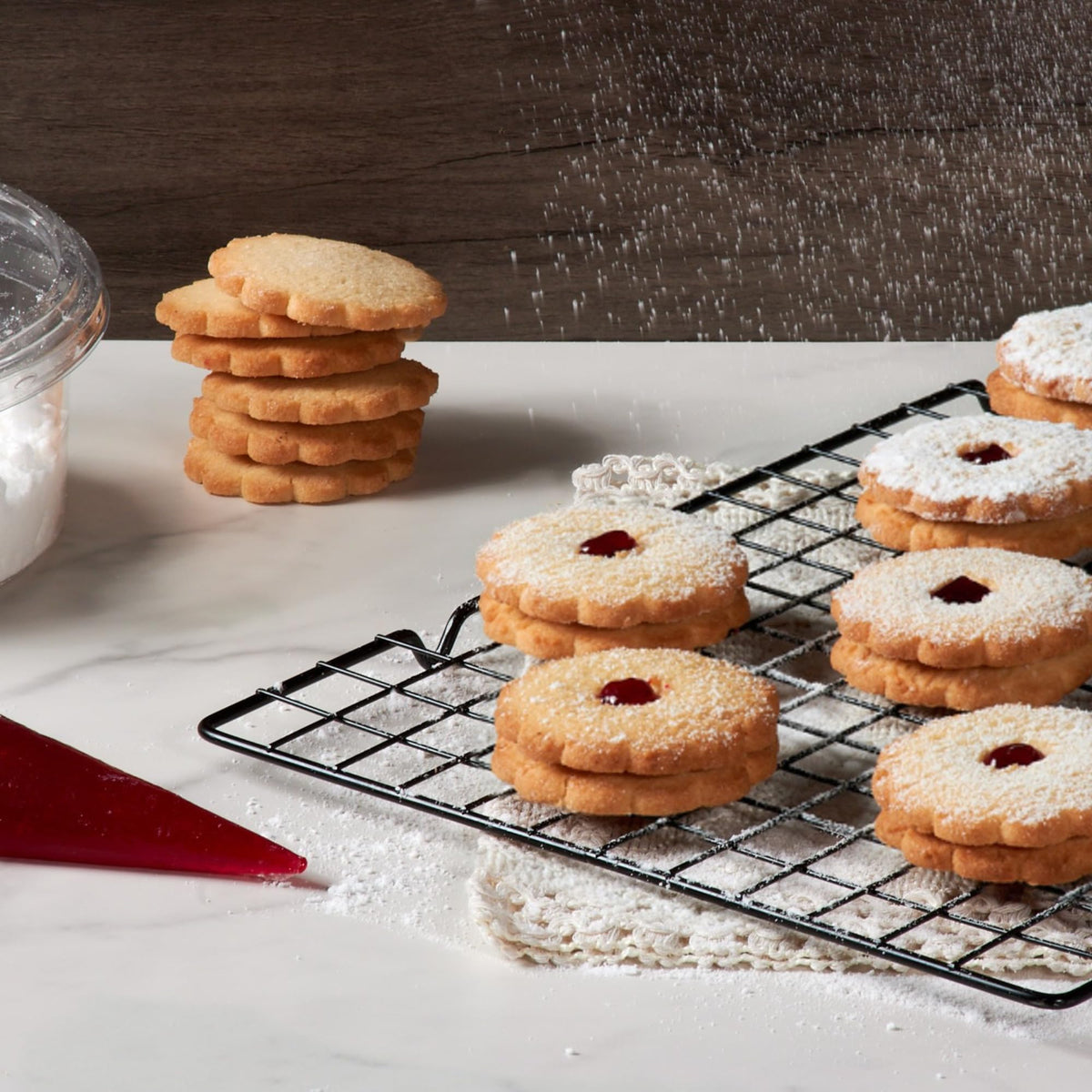 Stern's Bakery Linzer cookies texture – soft shortbread with a glossy raspberry center.