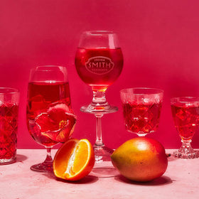 Steven Smith Teamaker hibiscus mango iced tea in glass reveals vibrant color