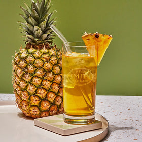 Steven Smith Teamaker Pineapple Green Iced Tea No. 81 served in a tall glass, inviting friends.