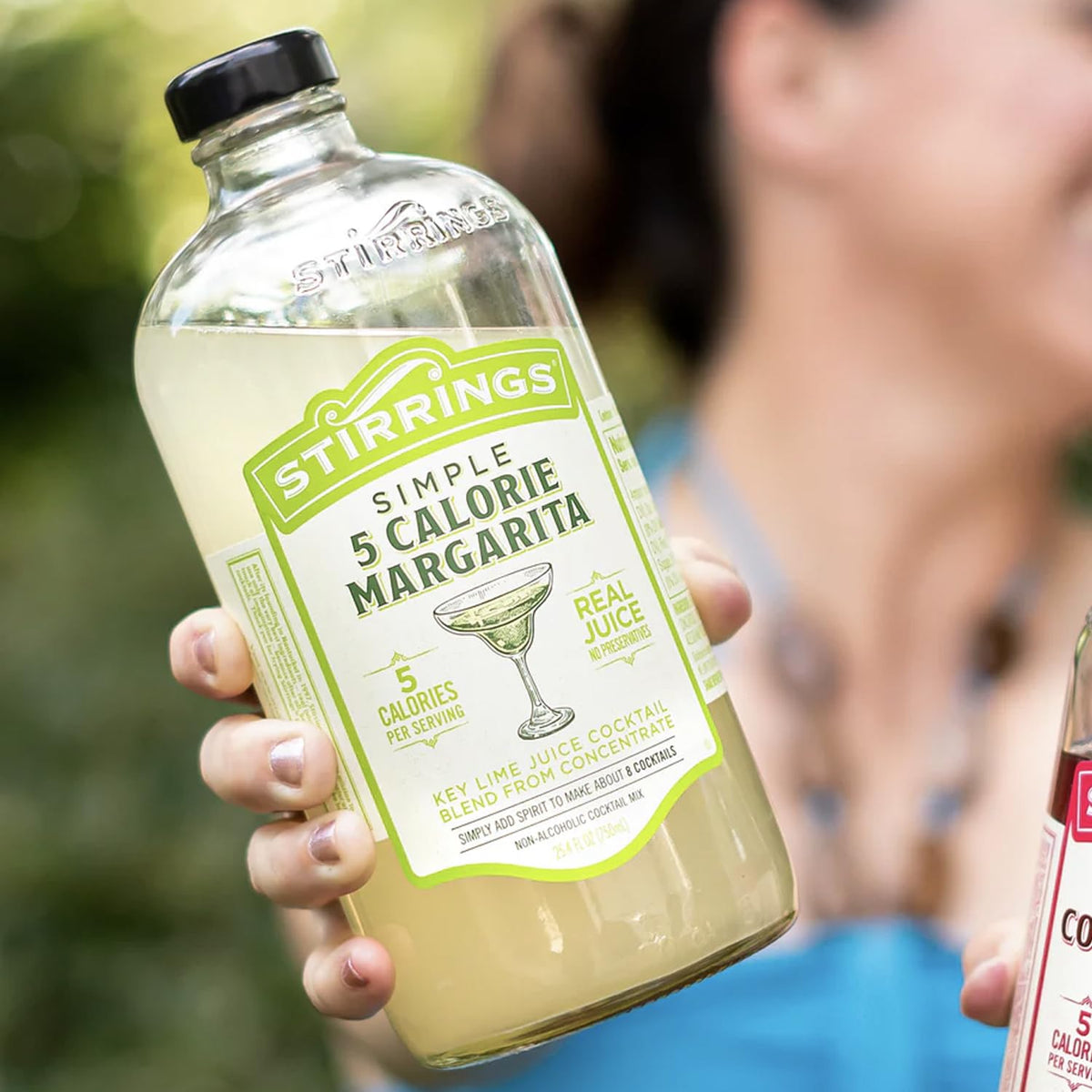 Stirrings Margarita Mix bottle pour for quick, flavorful cocktails.