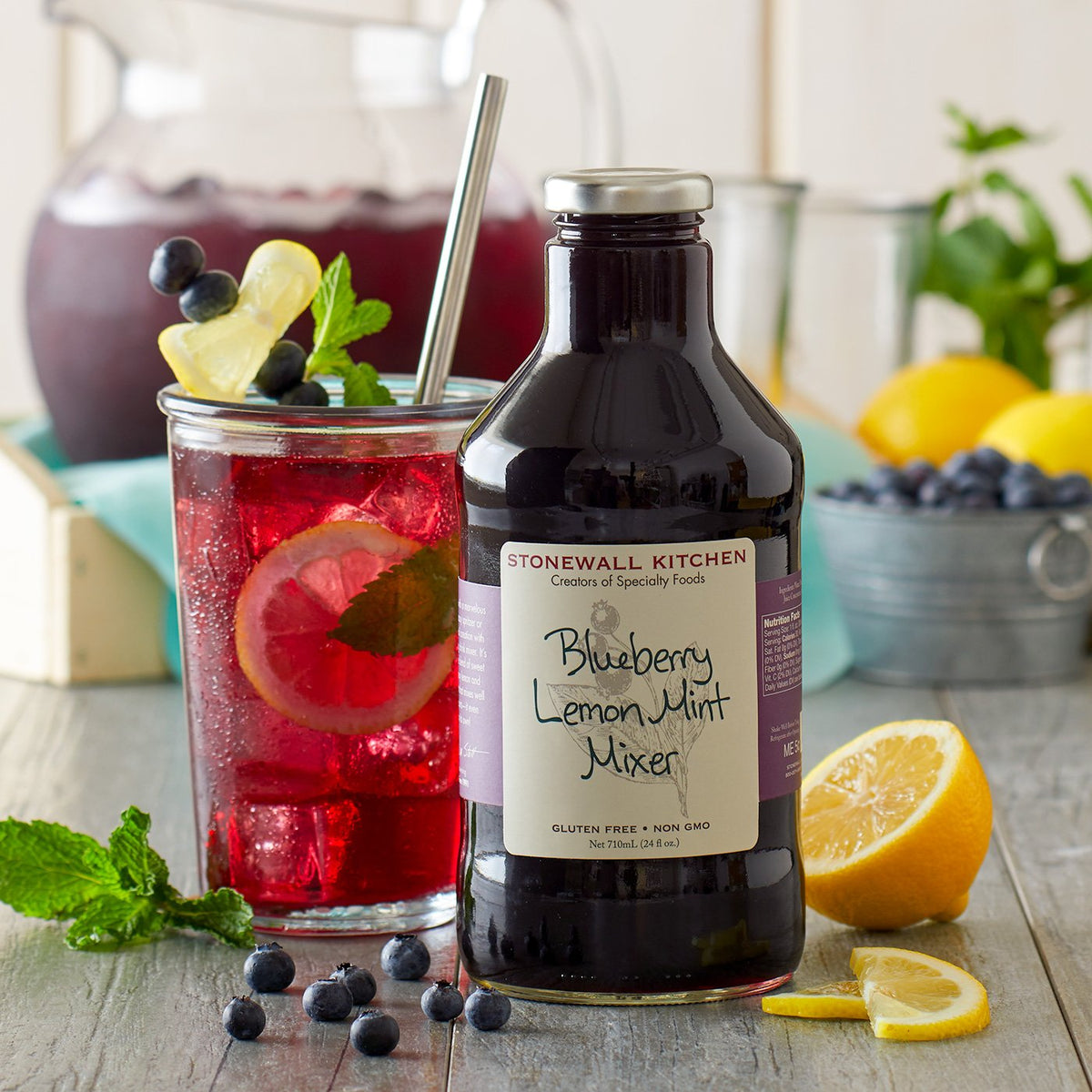 Stonewall Kitchen Blueberry Lemon Mint Mixer ingredients closeup highlights fresh berries, lemon, and mint