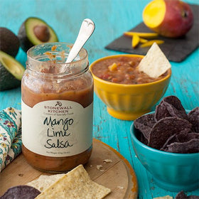 Stonewall Kitchen Mango Lime Salsa closeup shows bright fruit chunks and zesty seasoning.