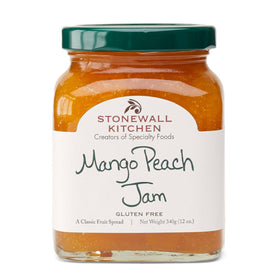 Stonewall Kitchen Mango Peach Jam jar on kitchen shelf, versatile for breakfast and desserts.