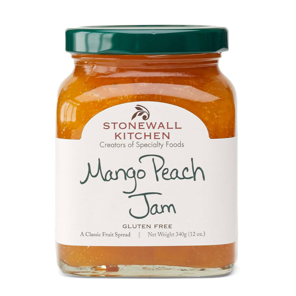 Stonewall Kitchen Mango Peach Jam jar on kitchen shelf, versatile for breakfast and desserts.