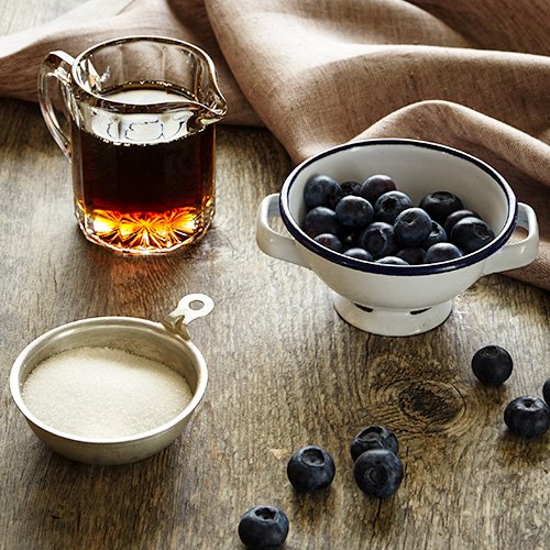 Stonewall Kitchen Maple Blueberry Syrup drizzle on pancakes to elevate morning favorites.