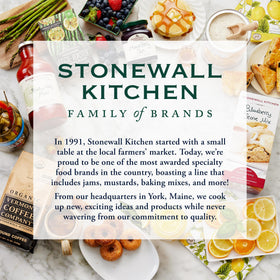 Raspberries and jam swirl in Stonewall Kitchen jar, inviting flavor
