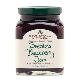 Stonewall Kitchen Seedless Blackberry Jam bottle on breakfast table, ideal for toast.
