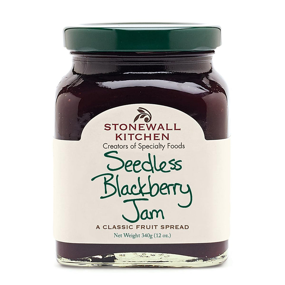 Stonewall Kitchen Seedless Blackberry Jam bottle on breakfast table, ideal for toast.