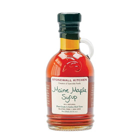 Stonewall Kitchen syrup pouring over pancakes evokes cozy breakfast moments and indulgent drizzle.