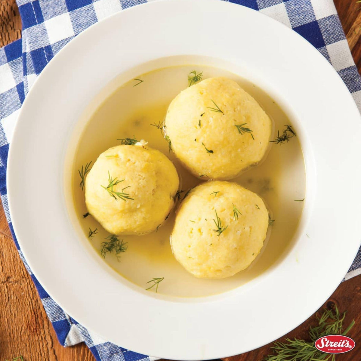 Streit's matzo ball soup served with tender matzo balls