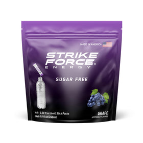 Strike Force Grape liquid pack dissolving in water for a refreshing energy boost.