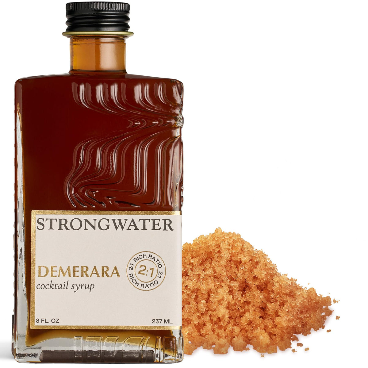 Strongwater Rich Demerara Syrup bottle on bar for elevating cocktails.