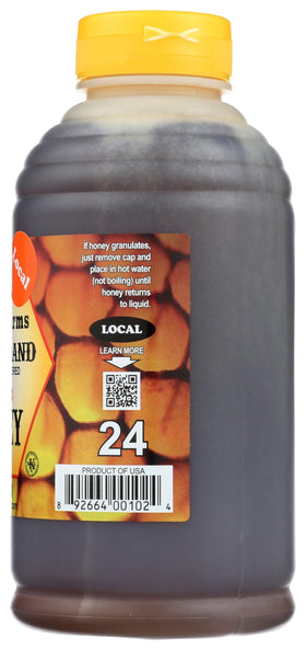 Stroope Farms Wildflower Honey with wooden dipper, smooth texture and aroma