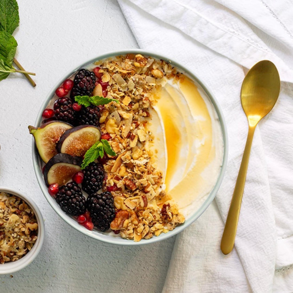 Struesli Original Granola bowl with yogurt and fruit offers versatile topping.