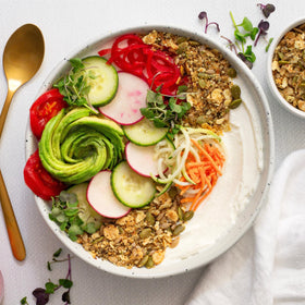 Serving bowl with Struesli Savory & Seed and yogurt for savory crunch