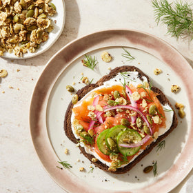 Snack plate featuring Struesli Savory & Seed granola as a savory bite