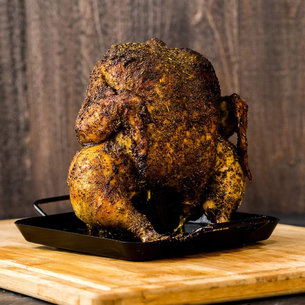 Pouring Stubb's Chicken Rub from a shaker as seasoning ready.