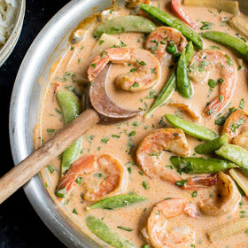 Spoonful of Stubb's red curry paste ready to sauté, delivering a bold aroma