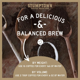 Stumptown Trapper Creek beans with grinder, ready for a flavorful grind.