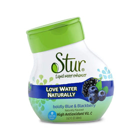 Pouring Stur Blueberry-Blackberry water enhancer to create fruit-infused water.