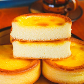 Success Imports Cake Egg Tarts creamy custard closeup highlighting smooth filling.