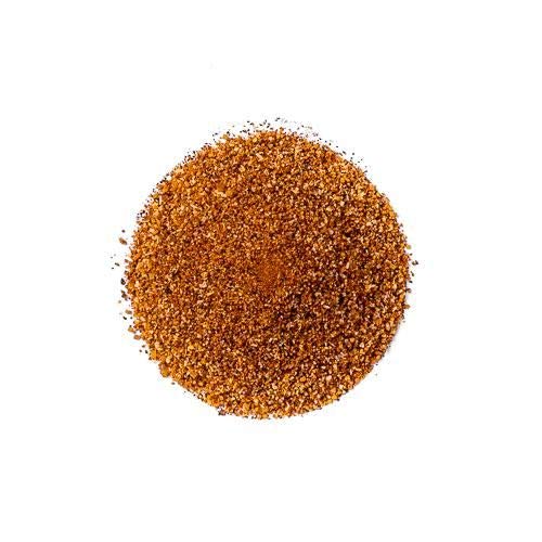 Close-up of Clucker Dust ingredients showing sweet and spicy pepper blend